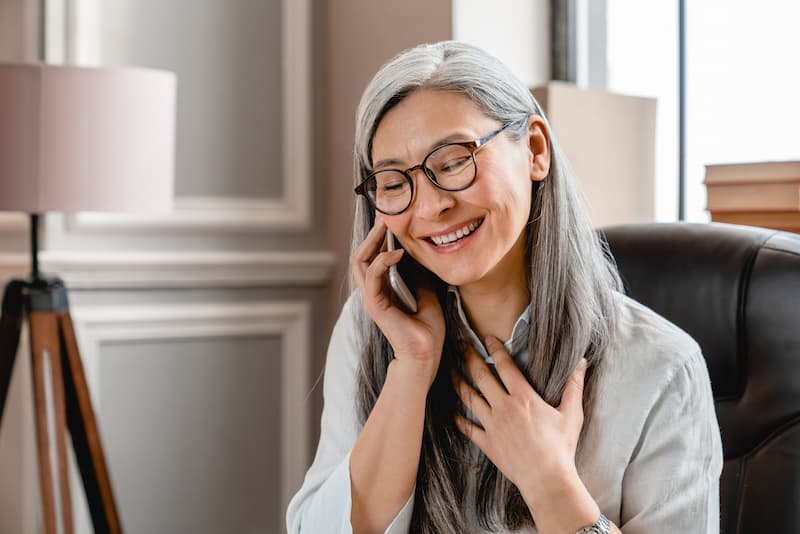 The Gardens of Buda | Senior making a phone call