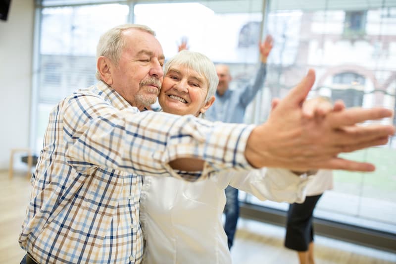 The Gardens of Buda | Senior couple dancing cheek to cheek